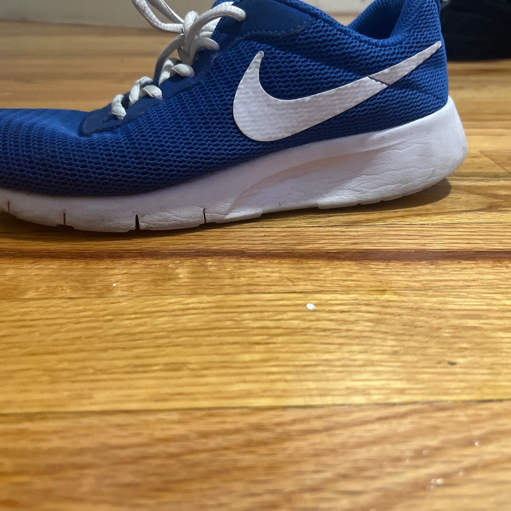 I am selling blue and white nike shoes